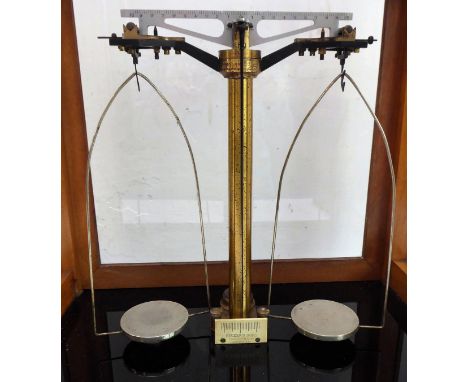 An early 20th century mahogany-cased chemist's balance with rising glazed front and maker's plaque, 'Becker's Sons, Rotterdam