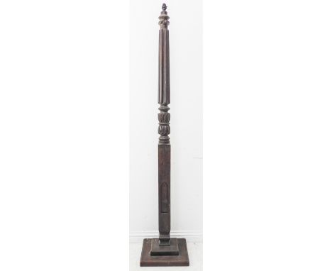 A tall mahogany lamp standard fitted for electricity, (probably a former four-poster bed-post); reeded top leading to acanthu