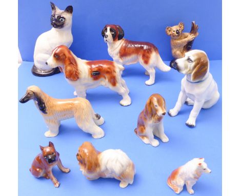 A selection of hand-decorated ceramic decorative animal model figures to include a large Royal Doulton cat, a large 'Coopercr