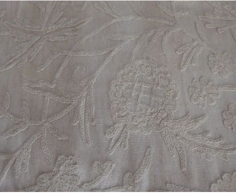 A pair of cream linen curtains with crewel embroidery together with matching pelmet edged with cream and burgundy braid, penc