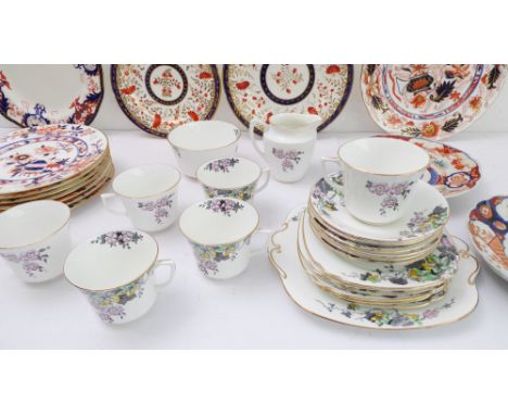 A Windsor Bone China part tea / cake service comprising cups, saucers, side plates, two-handled cake plates, sugar and creame