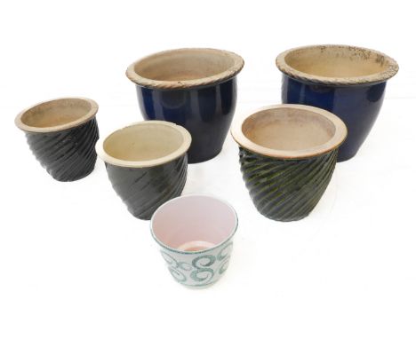 Seven ceramic and glazed garden planters: three graduated, a pair and two others. (The widest, a white glazed example with Gr
