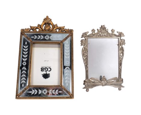 A cast silver plated Art Nouveau style strut frame, H22cm, and a decorative modern mirrored frame