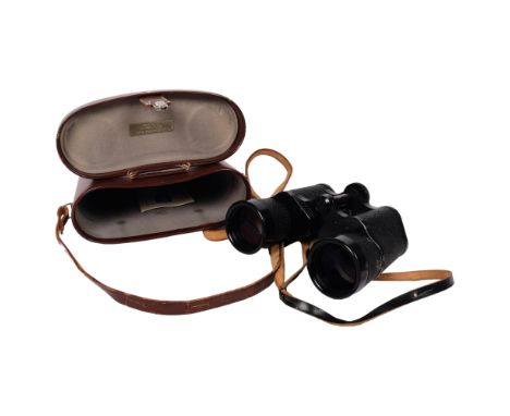 A pair of Carl Zeiss Jenna 10x50 binoculars, marked DDR to the left of the eyepiece, with original case, instruction manual a