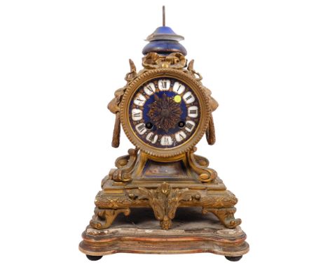 An Antique French gilt-bronze mantel clock, with enamel display, Roman numerals, with base (A/F) 