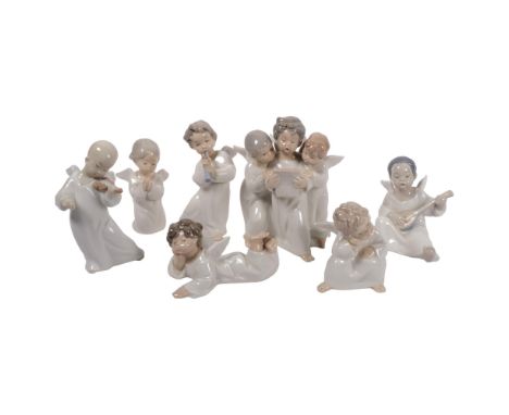 A quantity of Lladro angel porcelain figurines, several playing musical instruments, and a group of 3 singing, etc (7) 