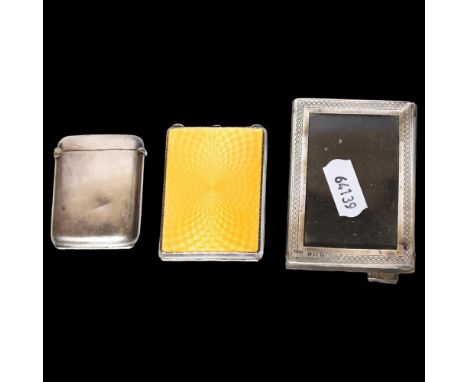 A George V engine turned silver and yellow enamelled matchbox case, a small rectangular silver-fronted frame, and a silver Ve