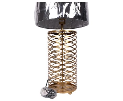 A contemporary table lamp and shade, with a pierced open latticework body, overall height 73cm 