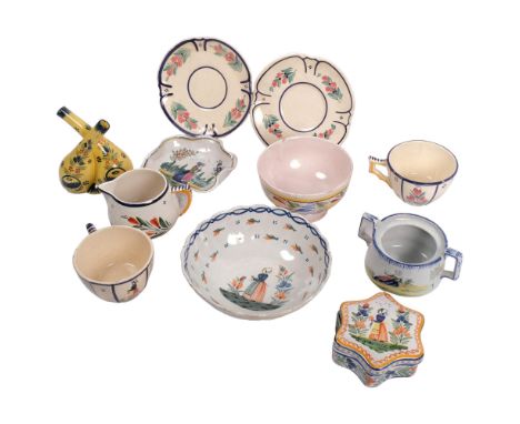 A group of Quimper pottery, including cups and saucers, oil and vinegar bottles