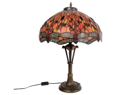 A Tiffany style twin-light table lamp on composition base, with multi-coloured dragonfly design leadlight shade, H60cm overal