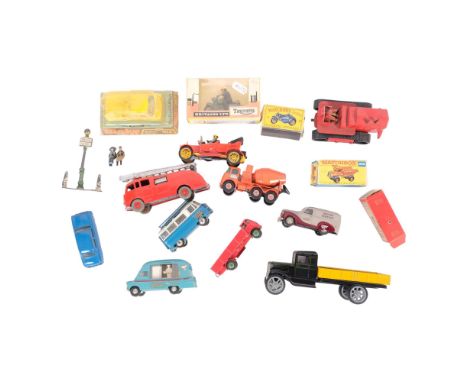 A group of loose diecast vehicles and accessories, including a boxed Britains Ltd Triumph model 9686, a Dinky Supertoys fire 