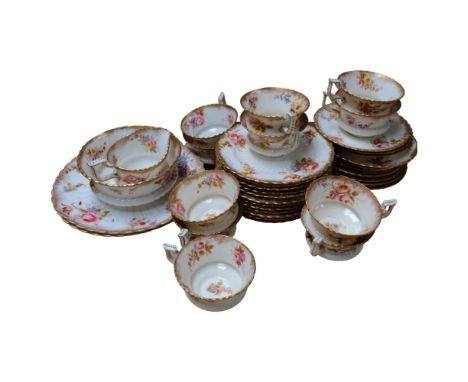 A Victorian hand painted part tea service, floral decoration with gold gilt finish, cups, saucers, side plates and a handful 