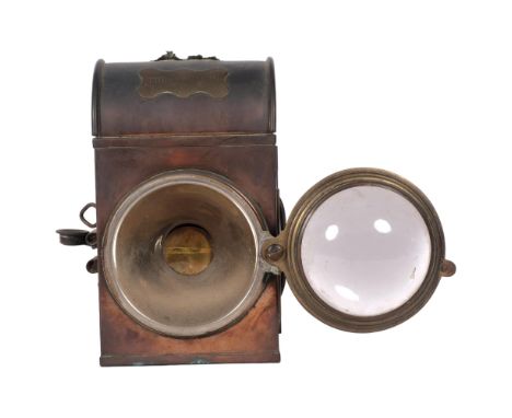 "The Eclipse", an Antique copper carriage lamp, with pivoted bulls eye glass panel, lacking carrying handle, H21.5cmGood over