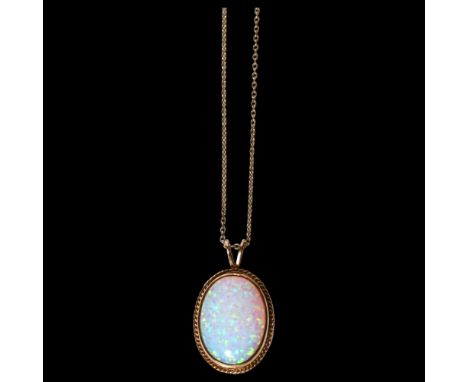 A 9ct gold Gilson synthetic opal pendant necklace, in rope twist surround with 9ct fine cable link chain, pendant height 30.2