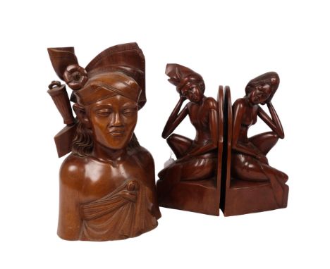 A pair of carved Balinese bookends, and a Balinese hunter bust by Fatimah, Bali, all signed to base, tallest 34cm 