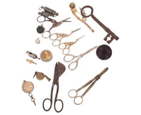 A group of various scissors, including a candle snuffer, a swan design sewing scissors, grape scissors etc, bosun's whistle, 