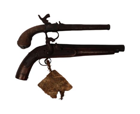 An 18th century percussion pistol, engraved barrel and handle, not working, and a 19th century Middle Eastern percussion pist