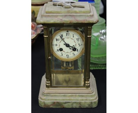 Onyx four glass mantel clock, with an enamel dial and Arabic hours