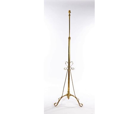 Early 20th Century brass standard oil lamp now converted to an electric lamp, on three scrolled supports, 155.5cm high