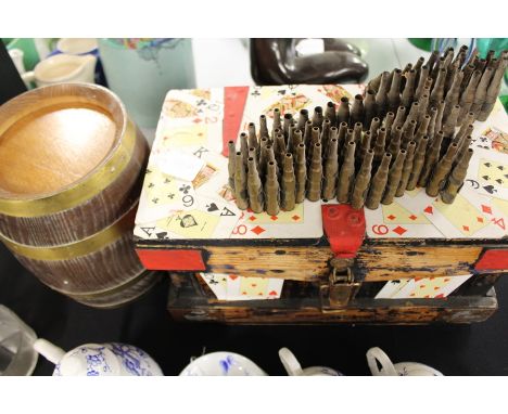 Works of art, to include a barrel, a trunk and a strip of bullets 