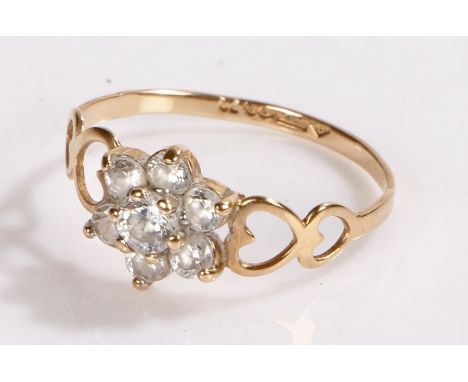 9 carat gold ring set with clear stones in a flower head formation, ring size N, 1.1g