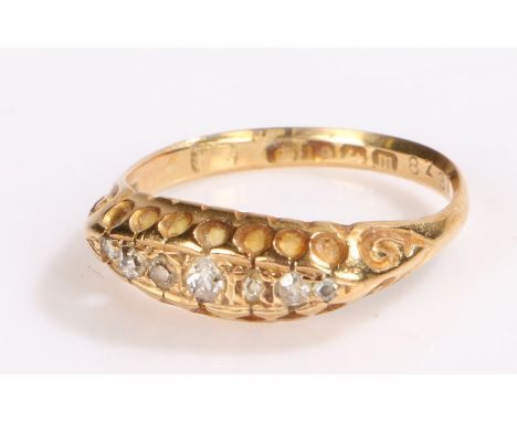 18 carat gold ring set with seven diamond chips, ring size L 1/2, 2.3g