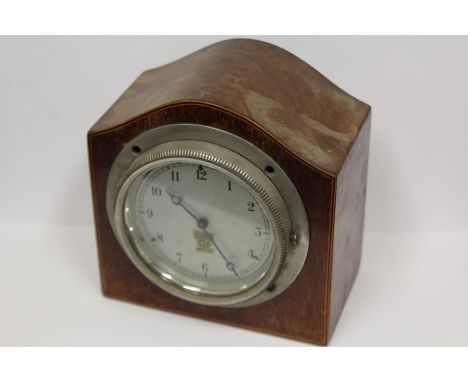 Smiths car clock, now mounted a s a mantel clock in a domed mahogany case, the silvered dial with Arabic numerals, 12.5cm wid