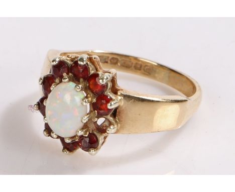 9 carat gold ring set with an opal surrounded by garnets, ring size N 1/2, 3.8g AF