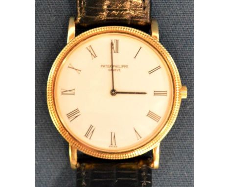 Patek Phillipe gents 18ct gold wristwatch currently fitted with a replacement strap but included is the original leather stra