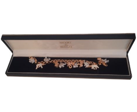 Brooks and Bentley Enamelled and Bejewelled elephant chain bracelet in original box, gold tone bracelet with 11 finely modell
