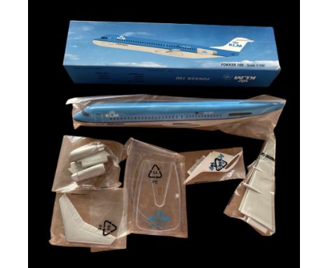 KLM FOKKER 100 model plane scale 1:100, in original box. Single item from £5.99 UK, £7.99 Europe, £9.99 ROW. We can ship a pa