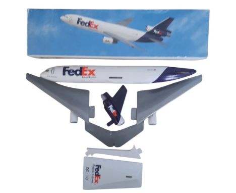 Fed Ex Federal Express DC-10 model plane, in original box. Single item from £5.99 UK, £7.99 Europe, £9.99 ROW. We can ship a 