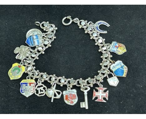 Silver charm bracelet with silver & enamel charms 