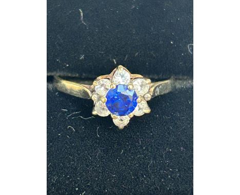 9ct Gold ring set with central blue sapphire surrounded by white sapphires Size M.5 Eeight 1.5g
