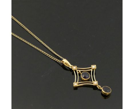 An Edwardian amethyst and seed pearl openwork pendant, with amethyst drop, stamped &lsquo;15ct&rsquo;, 4.6cm long including s