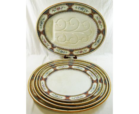 A large quantity of Minton 'Chinese Key' dinnerware comprised of two large oval serving plates, 55cm long, and three graduate