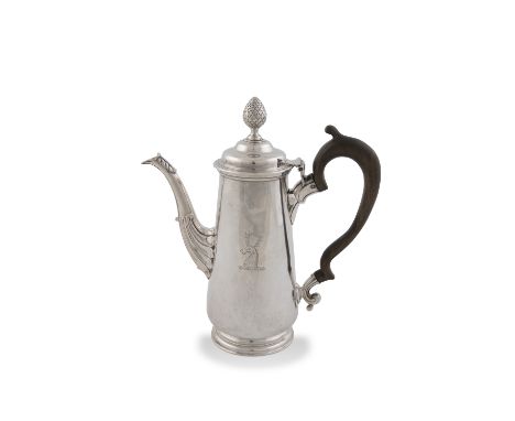 AN IRISH GEORGE II COFFEE POT, Dublin c.1750, of tapering form with tucked base on skirt foot, the domed hinged lid surmounte
