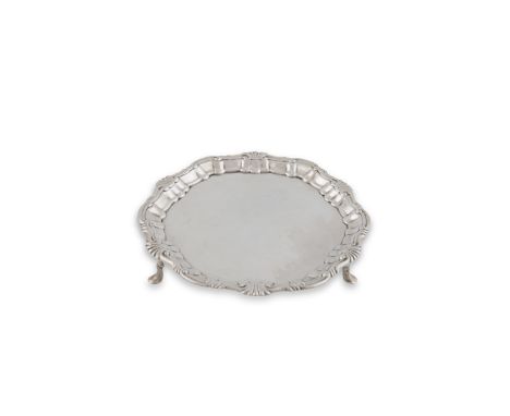 AN IRISH PROVINCIAL SALVER, Cork c.1765, mark of Michael McDermott, of shaped circular form, with raised shell and scrollwork