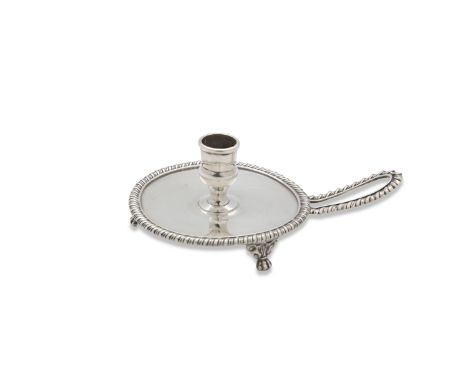 A GEORGE III CHAMBER CANDLESTICK, London 1813, mark of Joseph Craddock & William Ker Reid, the circular body with gadrooned r