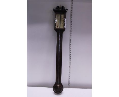 A Georgian style stick barometer. small chip to top of wooden case. Postage unavailable 