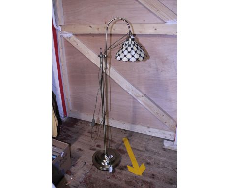 A tiffany style floor lamp. Postage unavailable 