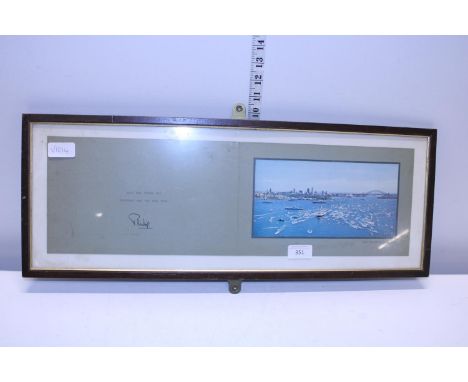 A framed vintage Christmas card of HMY Britannia signed Philip. Postage unavailable 