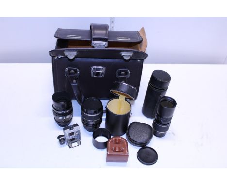 A selection of assorted 35mm camera lenses and a good quality lens case 