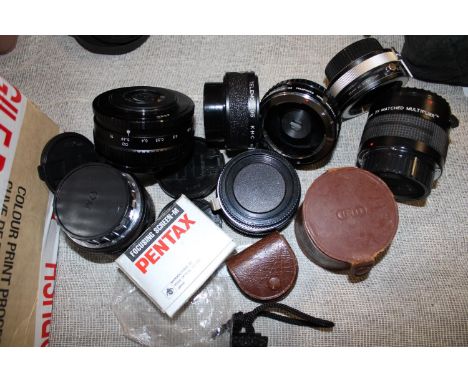 A selection of assorted camera lenses and filters 