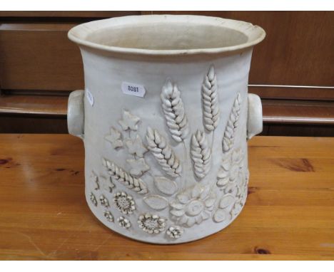 Large Stoneware planter with raised decorations and applied handles. Good order save for one minor nibble to lip.   10 inches