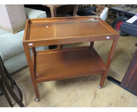 Mid to late 20th Century teak serving trolley with shelf under. Rides smoothly on original castors.  H:28 x W:29 x D:17 Inche