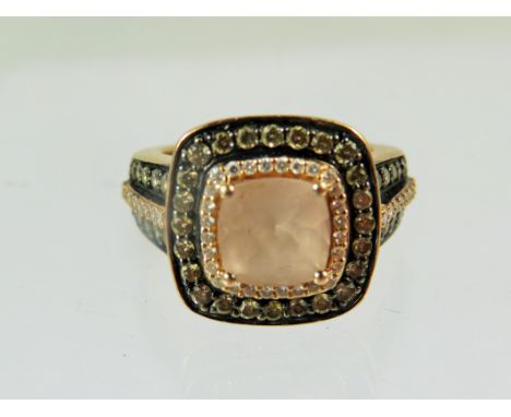 Stunning Le-Vian ring set with a central Morganite stone and surrounded by multiple Melee Diamonds of approx 0.70 cts.  All s