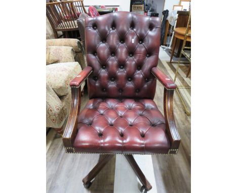 Lovely Dark Brown Chesterfield style button backed office or study chair. Height adjustable and set on a five branch mount wi