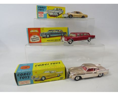 Three vintage Corgi Die cast models.  Models 245, 247, 211S.  All in excellent condition with original boxes.   See photos fo