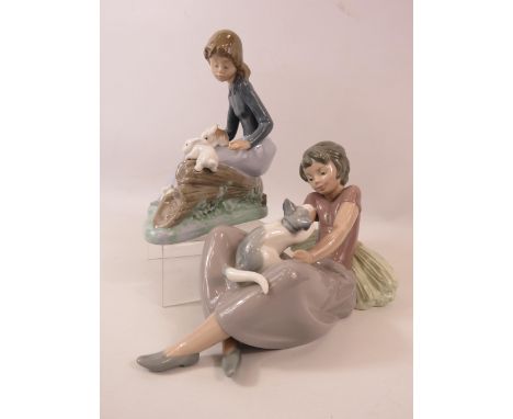 2 Nao Lladro figurines, a girl with 3 rabbits and a girl with a kitten.  The tallest measure 6 3/4" tall.